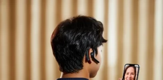 Timekettle W4 Pro Translator Lets You Hear the World a person wearing a headset. IFA 2024 News. Timekettle W4 Pro Translator review. {Tech} for Travel. https://techfortravel.co.uk