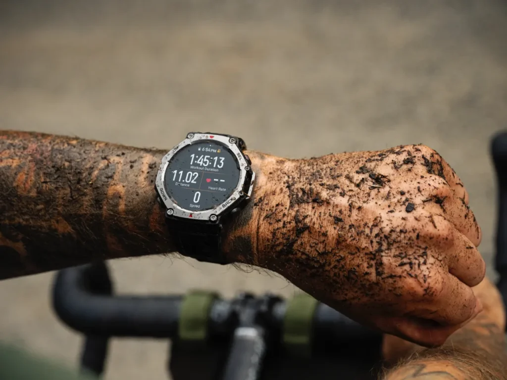 a person wearing a watch and showing mud on their wrist. Amazfit T-Rex 3 smartwatch. best of IFA. {Tech} for Travel. https://techfortravel.co.uk