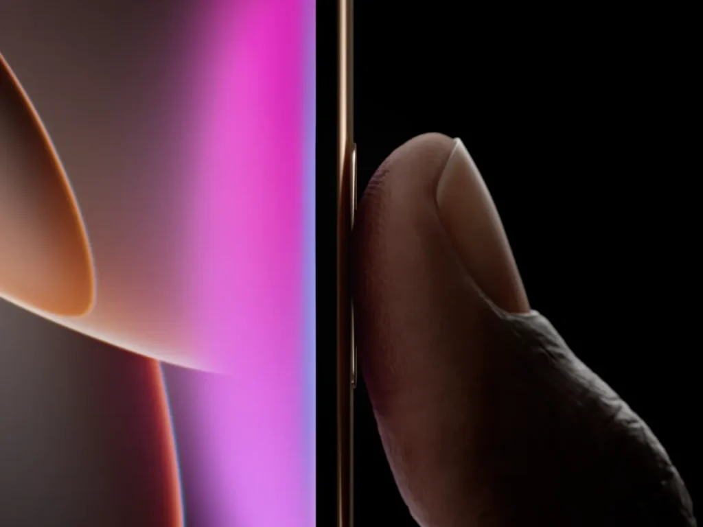 a finger touching a phone. Apple iPhone 16 Pro