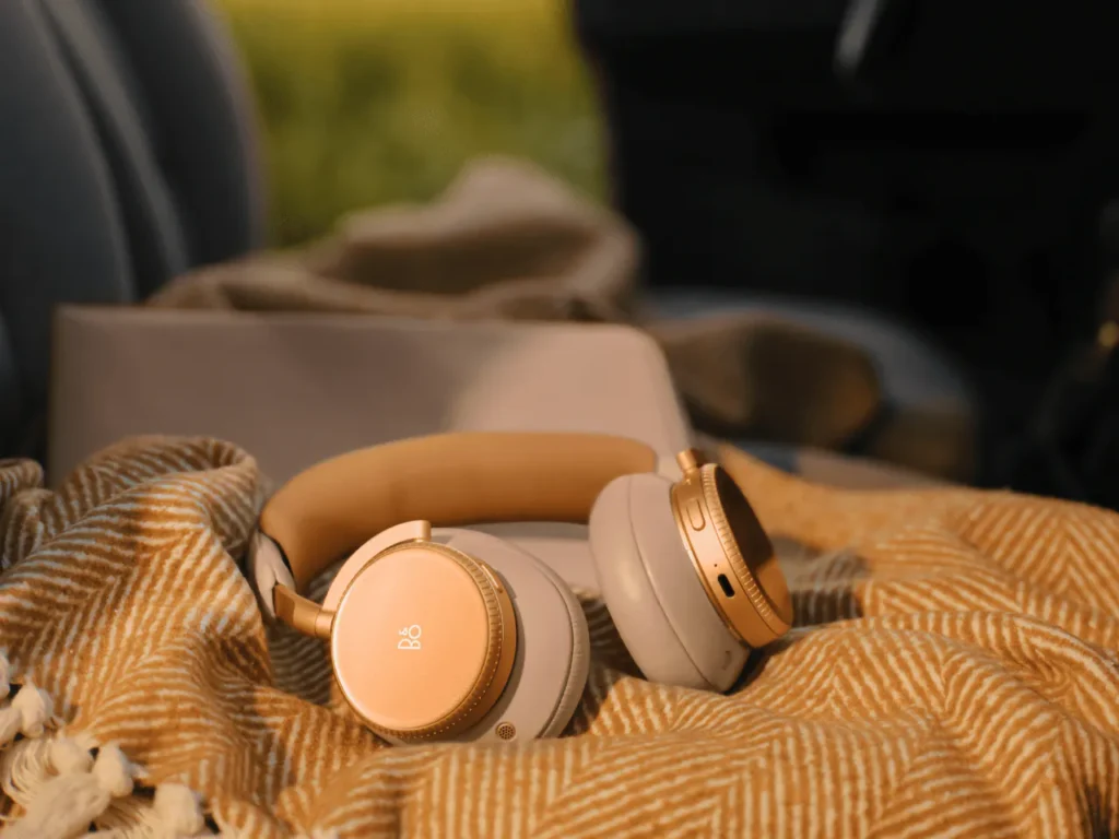 a pair of headphones on a blanket. B&O Beoplay H100 Headphones. {Tech} for Travel. https://techfortravel.co.uk