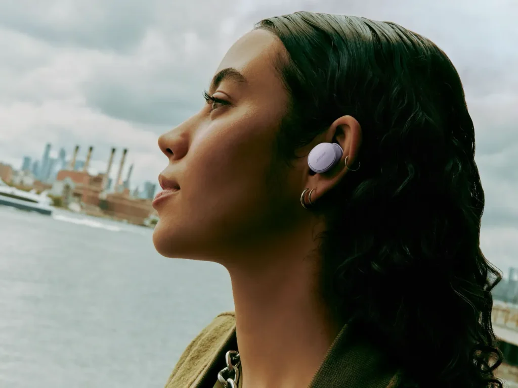 a woman with earbuds and earphones. Bose QuietComfort Earbuds In Ear.  {Tech} for Travel. https://techfortravel.co.uk