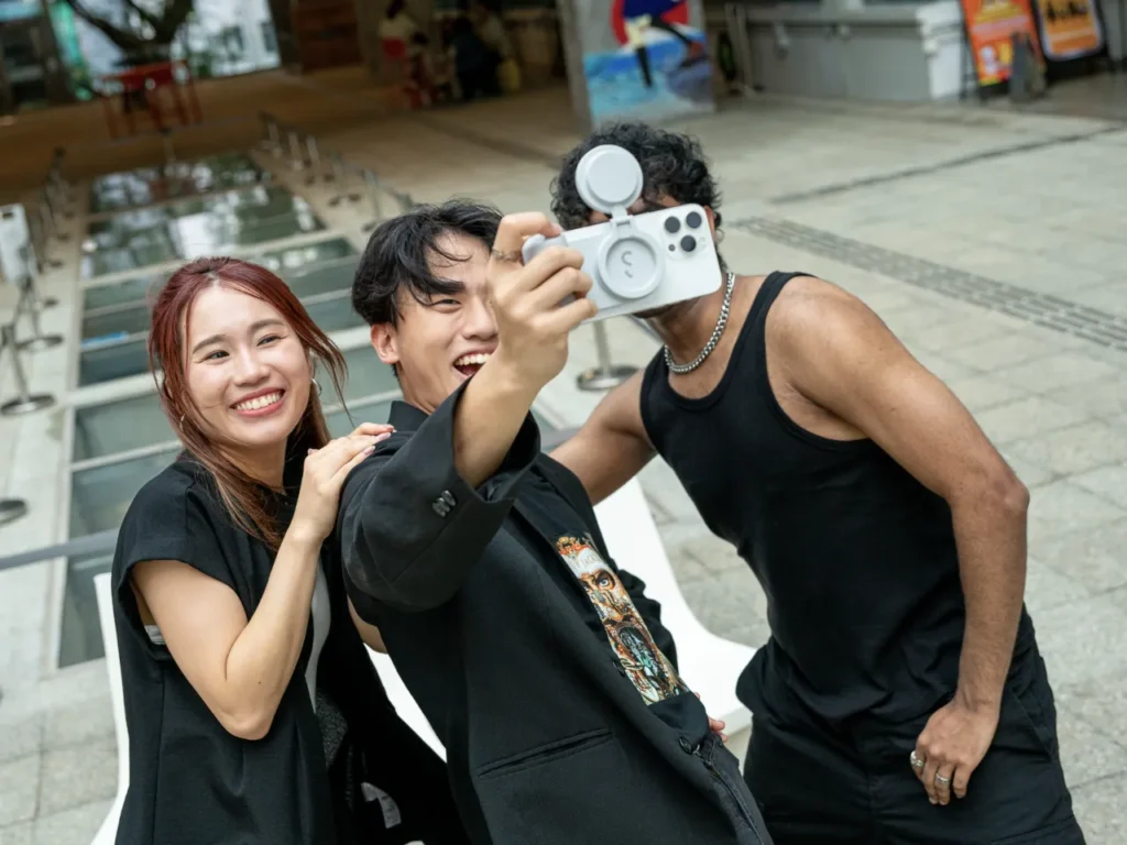 a group of people taking a selfie. Best of IFA 2024.  IFA 2024 News. ShiftCam Snapseries. {Tech} for Travel. https://techfortravel.co.uk