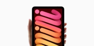 Apple iPad Mini 7th Gen Specifications & Overview a hand holding a cell phone. Apple iPad Mini 7th Gen in hand