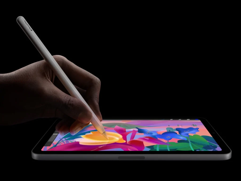 a hand holding a stylus on a tablet. Apple iPad Mini 7th Gen pencil pro. {Tech} for Travel. https://techfortravel.co.uk