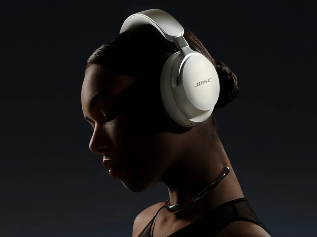 a woman wearing headphones. Bose QuietComfort Ultra Headphones.  Best Headphones for Travel 2025.  {Tech} for Travel. https://techfortravel.co.uk