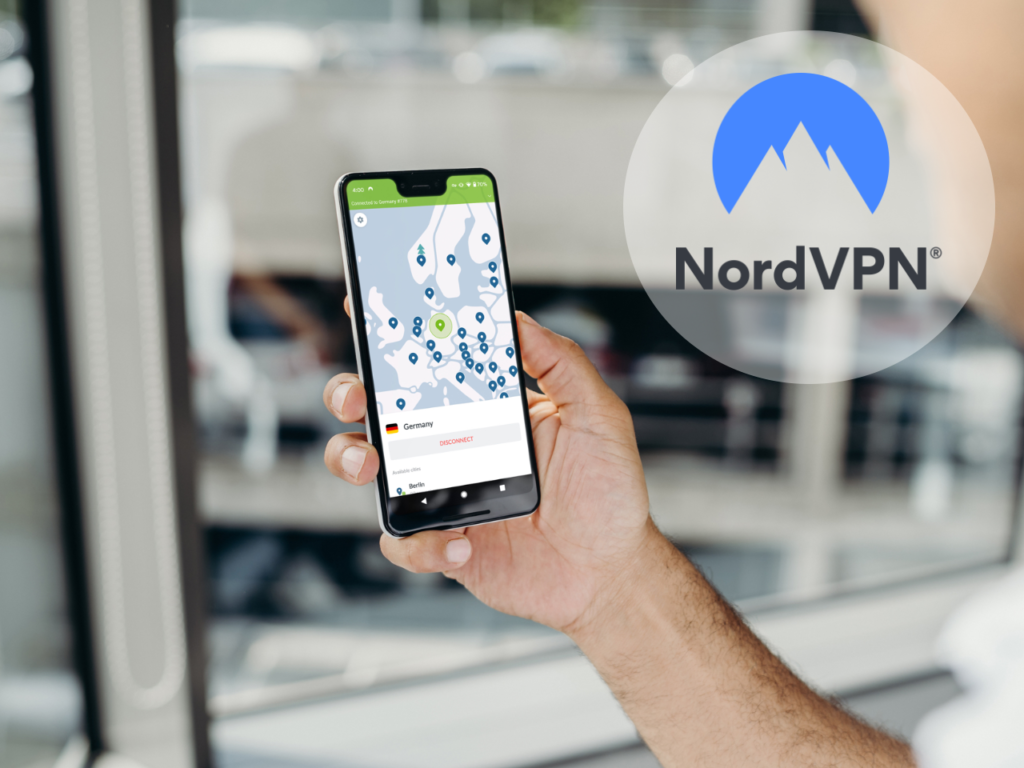 a hand holding a phone. NordVPN. Best Travel Apps 2025.  {Tech} for Travel. https://techfortravel.co.uk