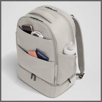 a backpack with a baby bottle and a cell phone in it. Black Friday Travel Deals. Away Black Friday Sale. {Tech} for Travel. https://techfortravel.co.uk