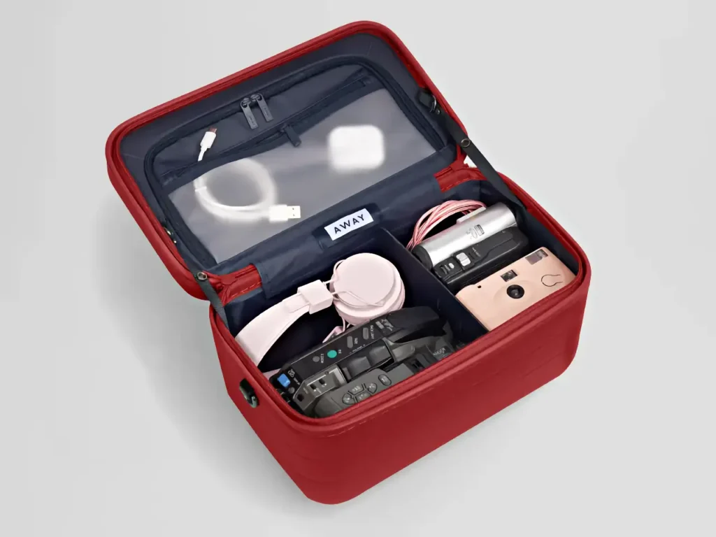 a red suitcase with electronics inside. Away Train Case. {Tech} for Travel. https://techfortravel.co.uk