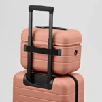 Travel Light with the Away Train Case a close up of a suitcase. Away Train Case.