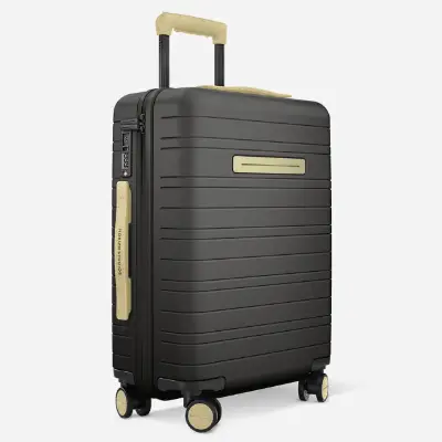 a black suitcase with wheels. Black Friday Travel Deals. Horizn Studios Black Friday Sale. {Tech} for Travel. https://techfortravel.co.uk