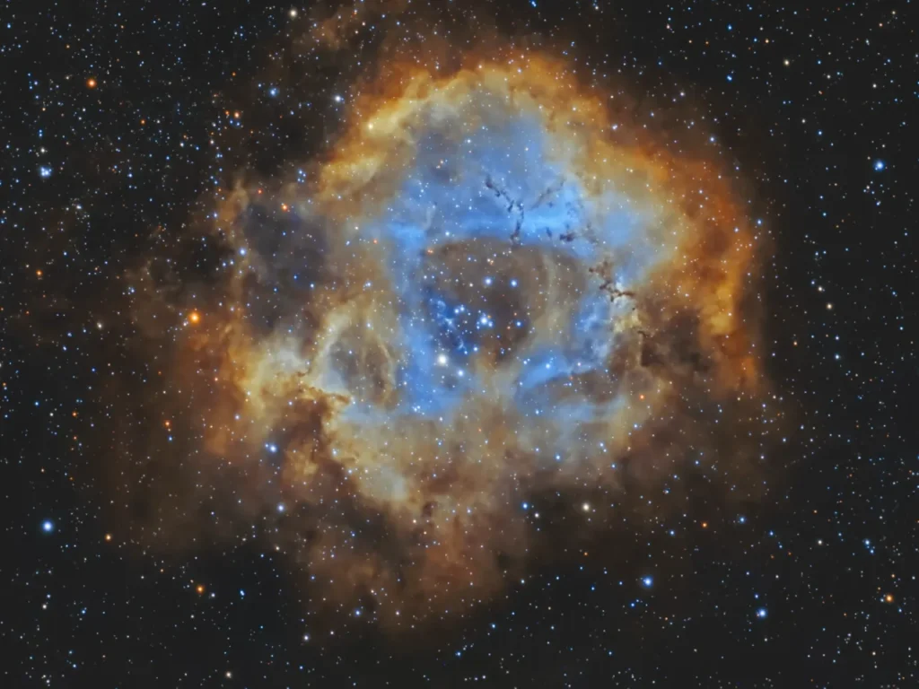 a blue and orange nebula in space