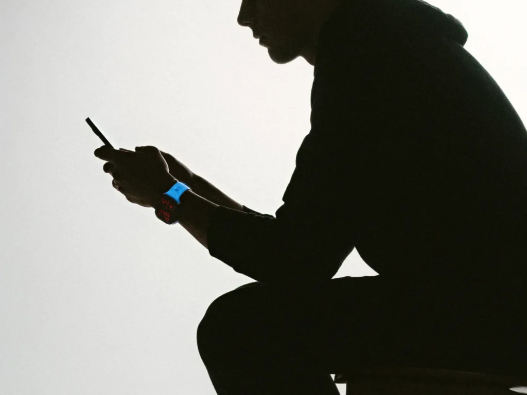 a silhouette of a man holding a phone. Nomad Goods Limited Edition Icy Blue Glow. Nomad Goods Limited Edition Icy Blue Glow.  {Tech} for Travel. https://techfortravel.co.uk