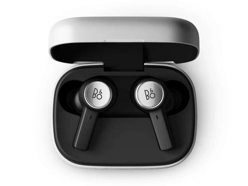 a pair of black and white earbuds in a case. B&O Beoplay Eleven Earbuds. {Tech} for Travel. https://techfortravel.co.uk