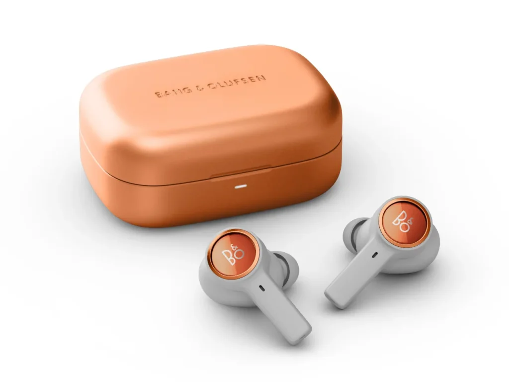 a pair of earbuds next to a case. B&O Beoplay Eleven Earbuds Copper Tone. {Tech} for Travel. https://techfortravel.co.uk