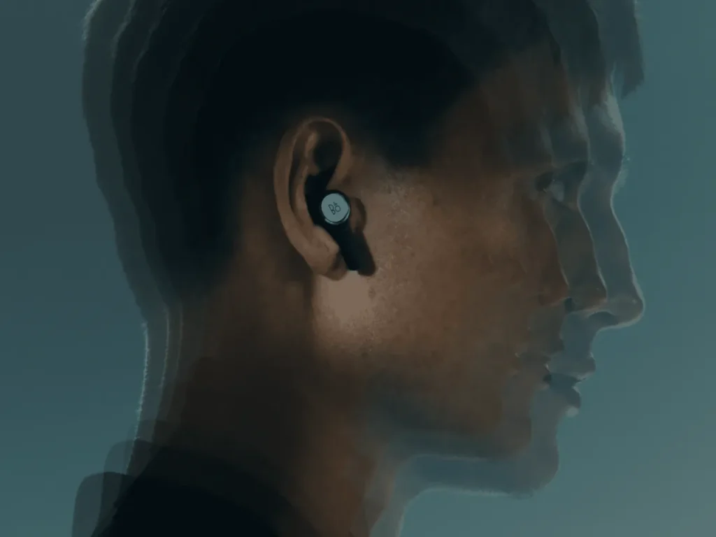 a man with a bluetooth earbud. Beoplay Eleven Earbuds. {Tech} for Travel. https://techfortravel.co.uk