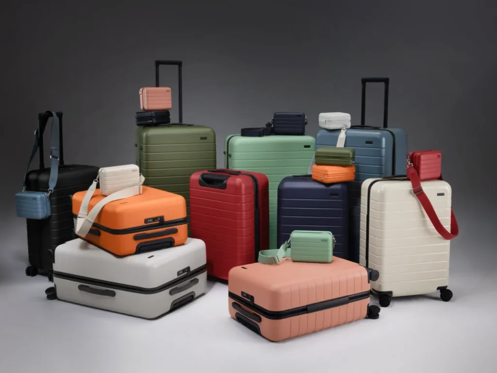 a group of luggage on a white surface. Away Suitcases. {Tech} for Travel. https://techfortravel.co.uk