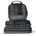 a stack of grey bags. Gomatic Packing Cubes. Nomatic Packing Cubes. {Tech} for Travel. https://techfortravel.co.uk