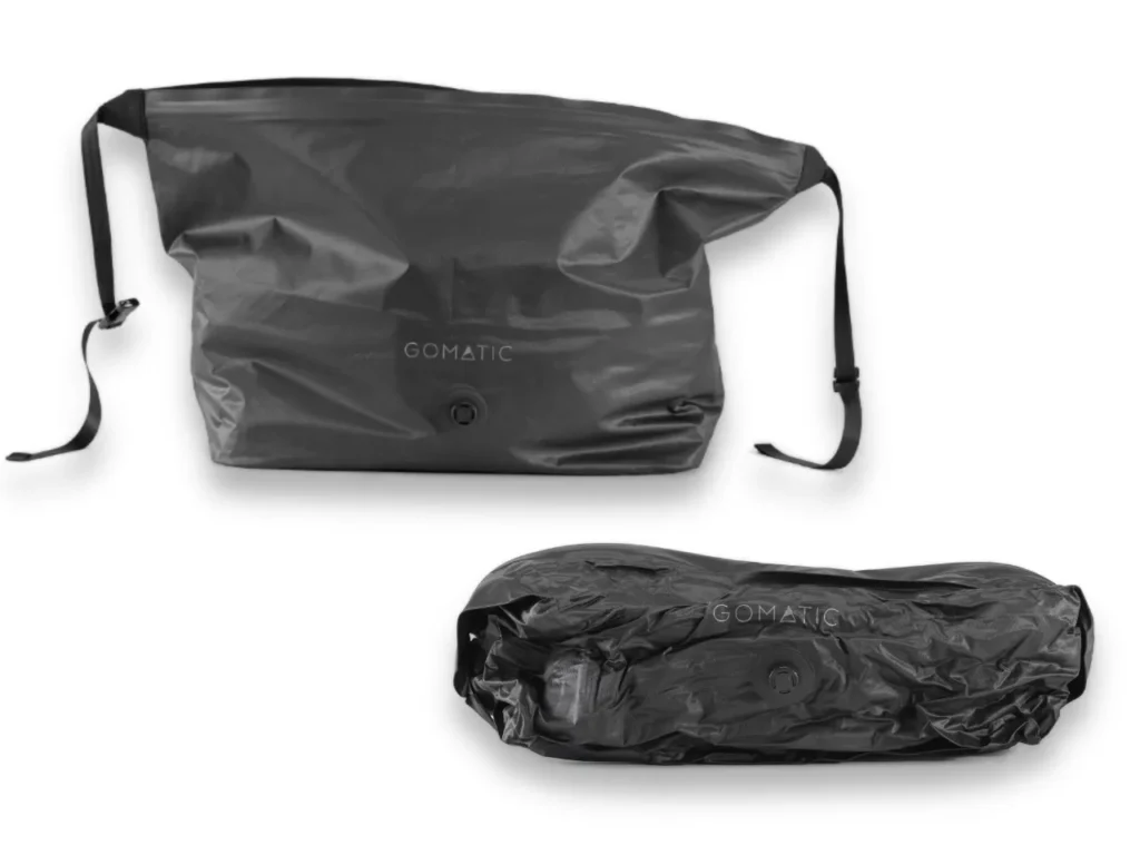 a black plastic bag with a strap. Gomatic Packing Cubes. Nomatic Packing Cubes. Gomatic Accessories. {Tech} for Travel. https://techfortravel.co.uk