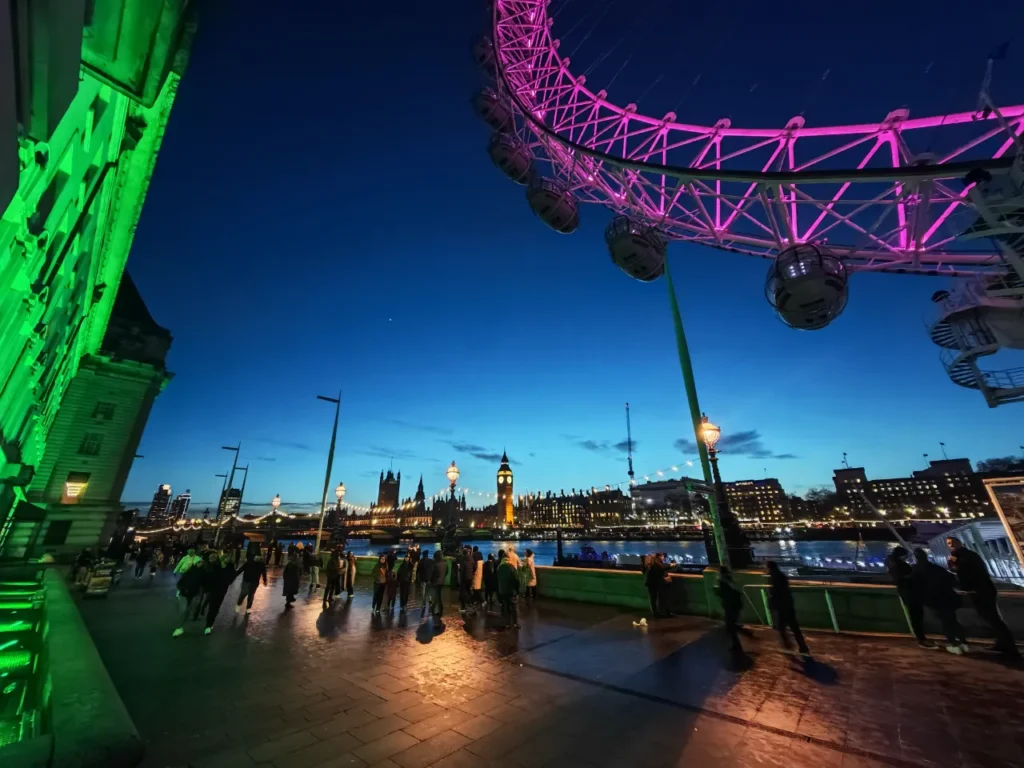 a ferris wheel with people walking around. HONOR Magic7 Pro Review.  {Tech} for Travel. https://techfortravel.co.uk