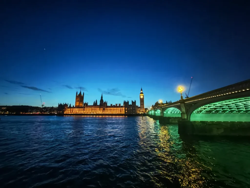 a bridge over water with a lit up castle and a clock tower. HONOR Magic7 Pro Review.  {Tech} for Travel. https://techfortravel.co.uk