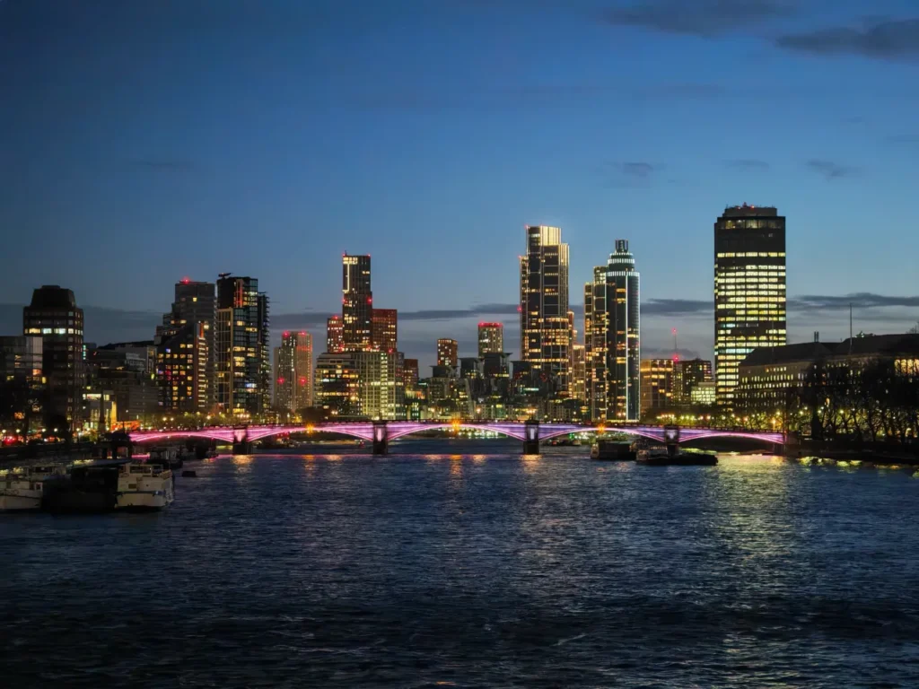 a city skyline with lights and a bridge over water. HONOR Magic7 Pro Review.  {Tech} for Travel. https://techfortravel.co.uk