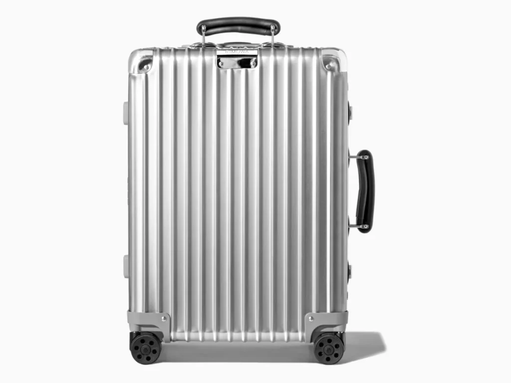 a silver suitcase with black wheels. RIMOWA Original Cabin. Best Carry-On Cases 2025. {Tech} for Travel. https://techfortravel.co.uk