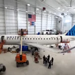 United Airlines Starlink Wi-Fi Begins Regional Rollout a plane in a hangar. United Airlines Starlink