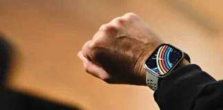 Amazfit Bip 6 Adds HYROX Mode and 2-Week Battery Life a person wearing a smart watch. AMazfit Bip 6 Smartwatch