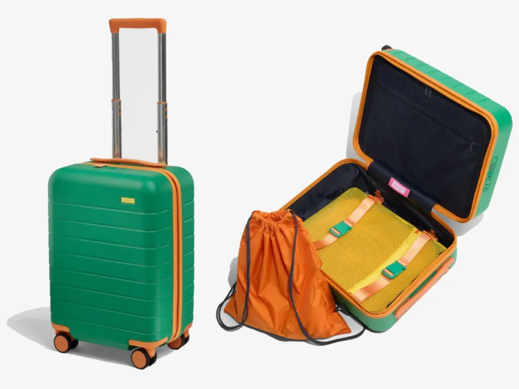 Away Kids Collection Carry-On Profile – {Tech} for Travel a green suitcase with orange handle and a bag. Away Kids Collection Carry-On. {Tech} for Travel. https://techfortravel.co.uk