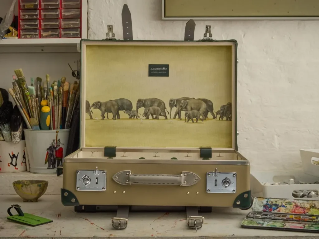 Globe-Trotter Elephant Family Collection Artwork – {Tech} for Travel an open suitcase with elephants inside. Globe-Trotter Elephant Family collection. {Tech} for Travel. https://techfortravel.co.uk