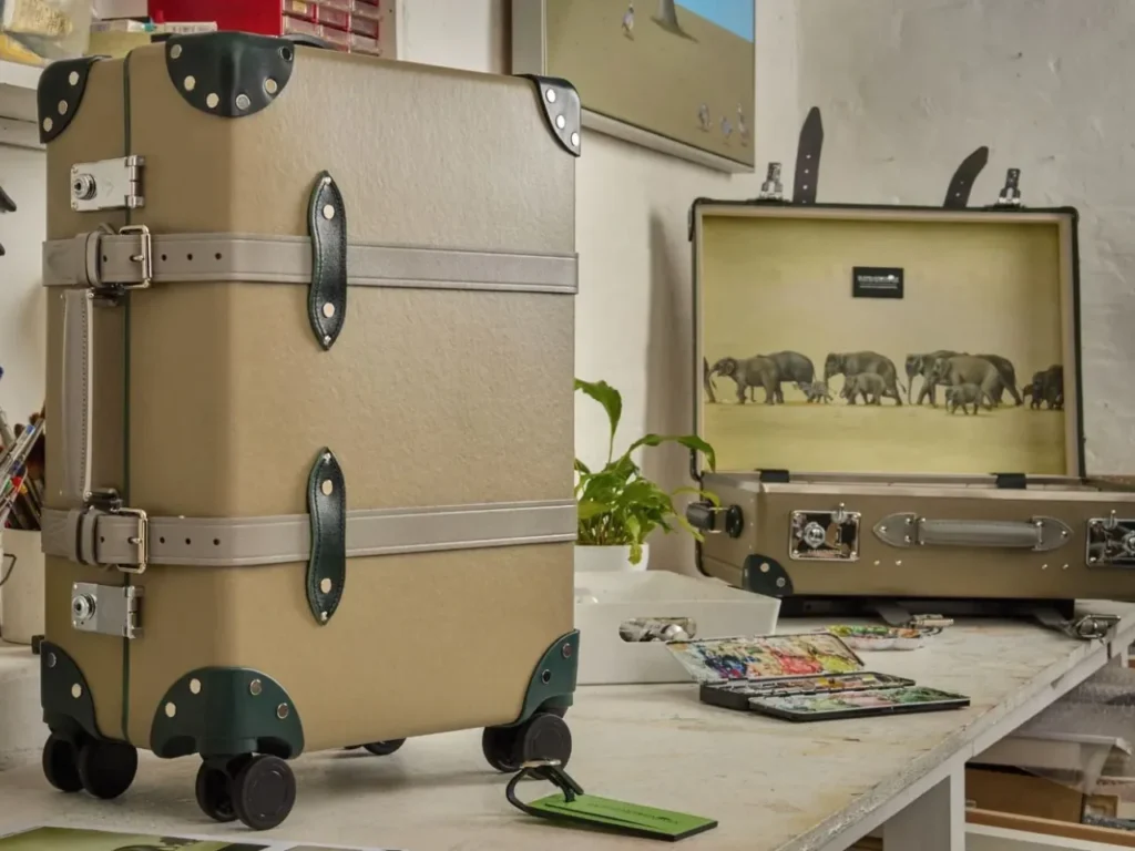 Globe-Trotter Elephant Family Collection Hero – {Tech} for Travel a suitcases on a table. Globe-Trotter Elephant Family collection. {Tech} for Travel. https://techfortravel.co.uk