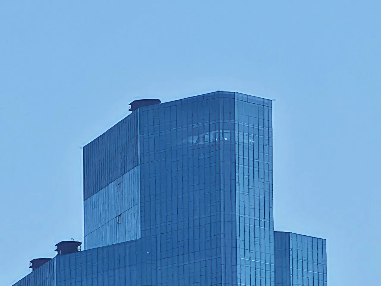a tall building with glass windows