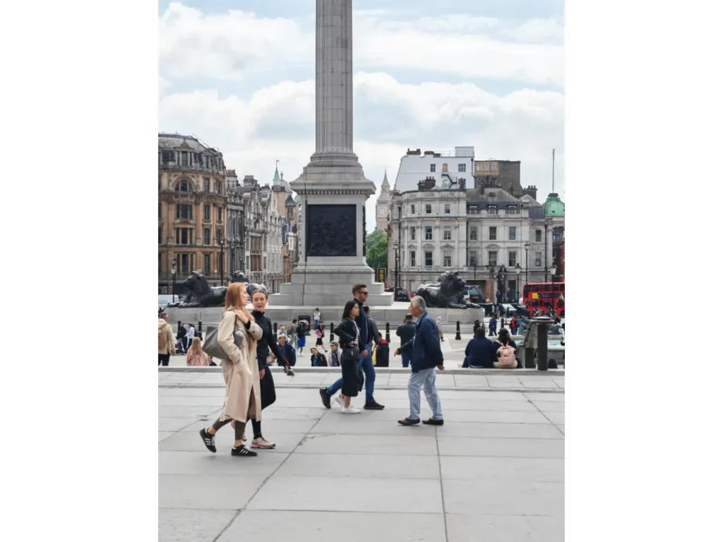 a group of people walking in a city