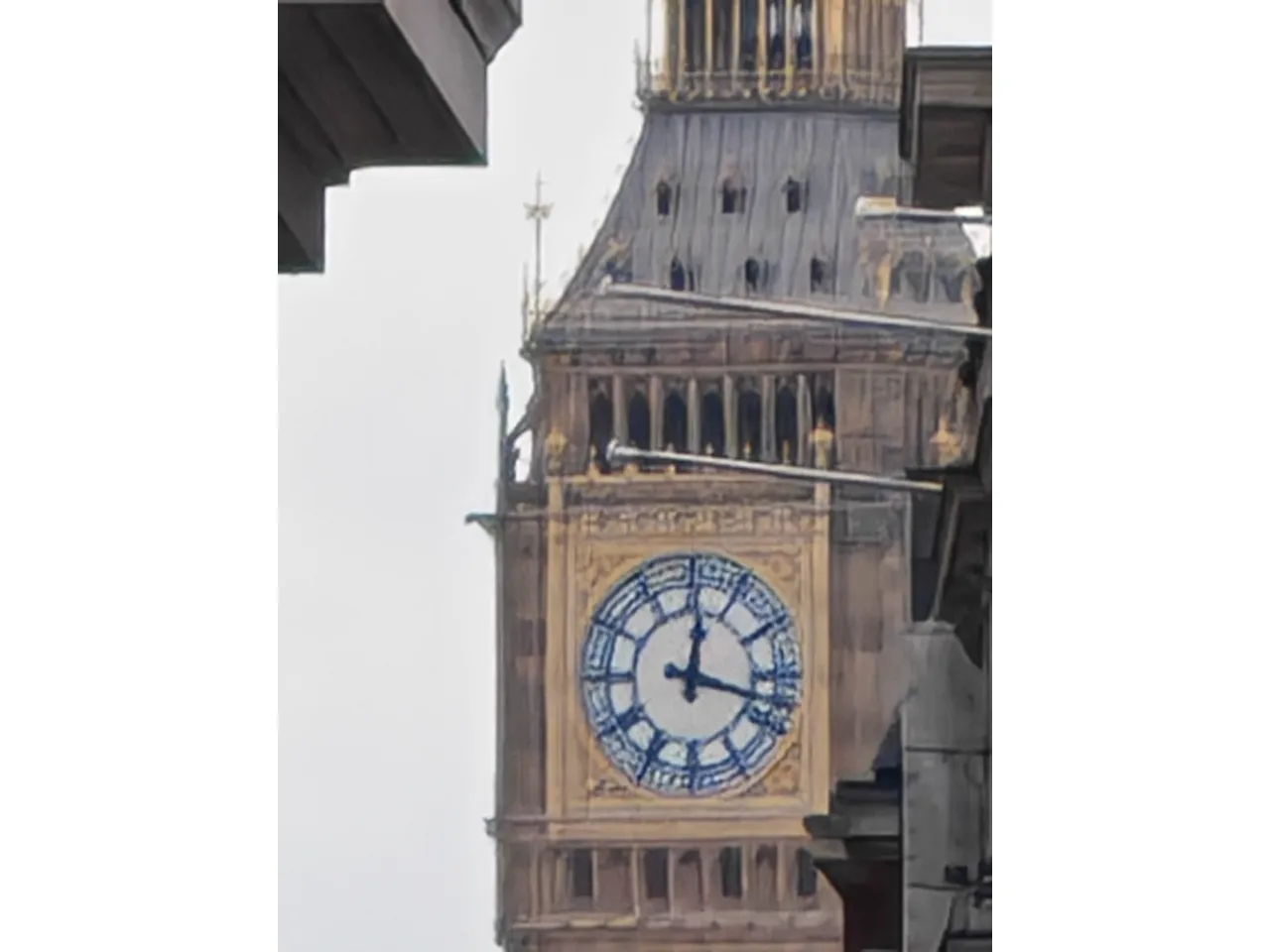 a clock tower with a blue and white face
