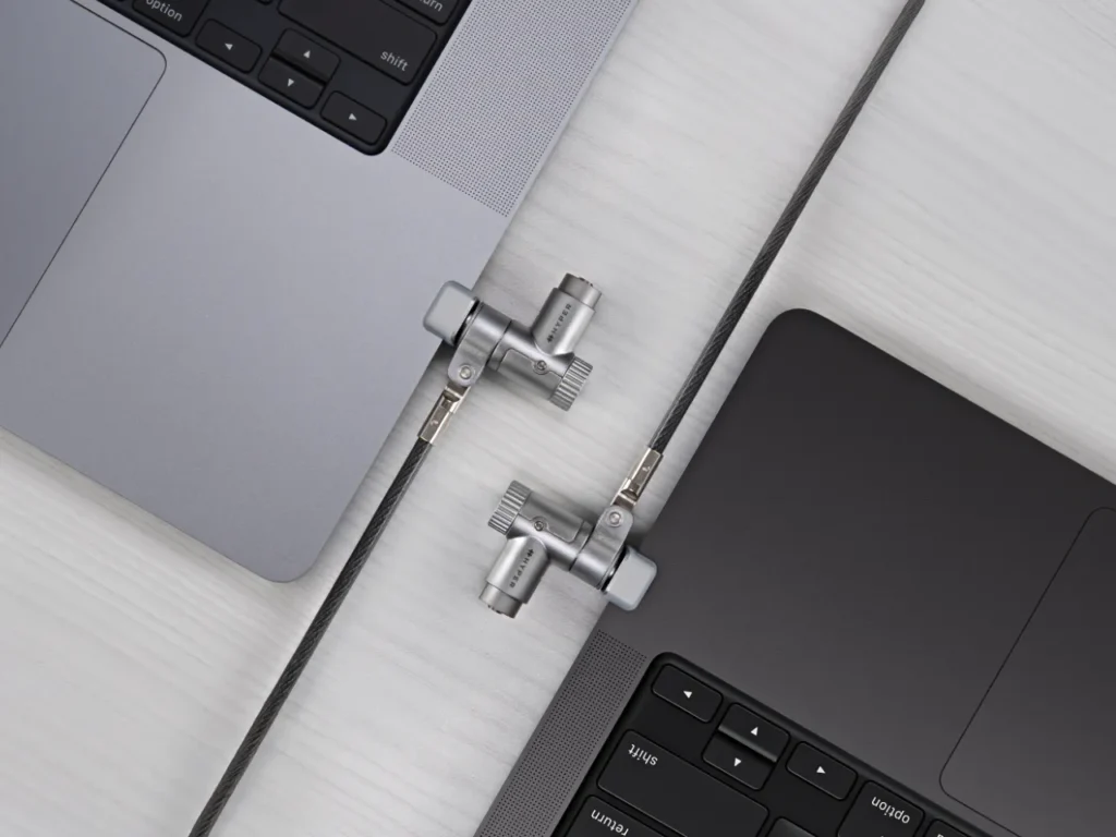 HyperShield MacBook Pro Cable Lock In Use – {Tech} for Travel a close up of a laptop. HyperShield MacBook Pro Cable Lock. {Tech} for Travel. https://techfortravel.co.uk