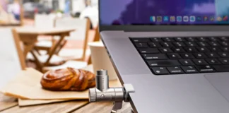 HyperShield MacBook Pro Cable Lock Secures Without Tools a laptop with a microphone attached to the back. HyperShield MacBook Pro Cable Lock. {Tech} for Travel. https://techfortravel.co.uk