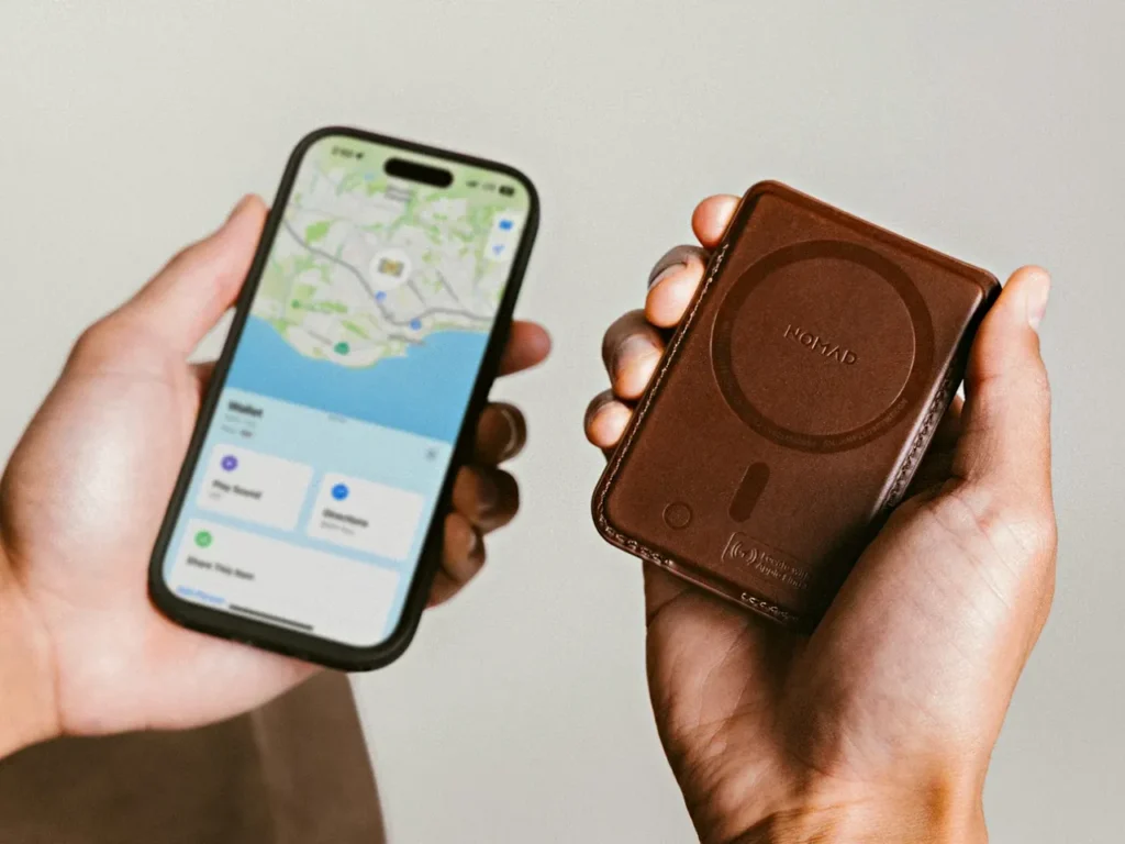 Nomad Goods Leather Mag Wallet Find My – {Tech} for Travel a person holding a phone and a case. Nomad Leather Mag Wallet. {Tech} for Travel. https://techfortravel.co.uk