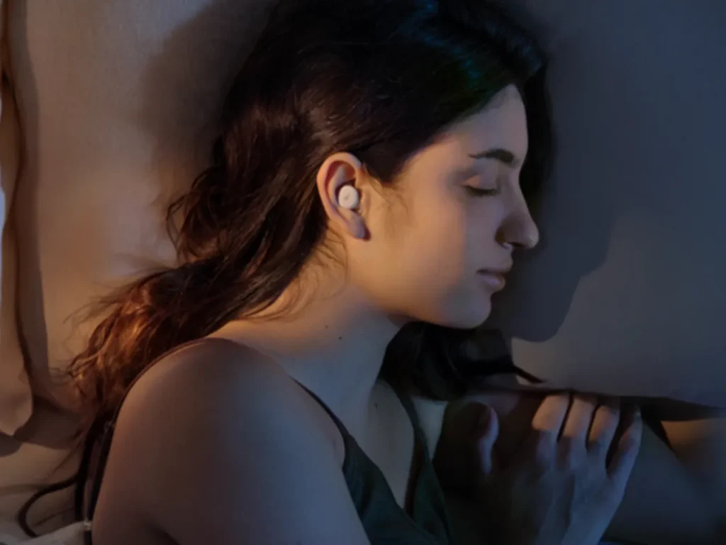 Soundcore Sleep A30 Model – {Tech} for Travel a woman sleeping on a couch. Soundcore Sleep A30. {Tech} for Travel. https://techfortravel.co.uk