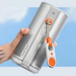 a hand holding a speaker. XGIMI MoGO 4 Projector