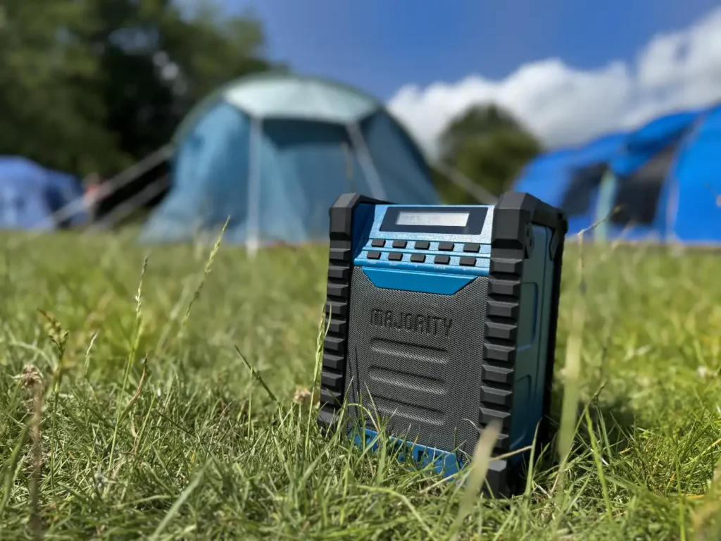 Majority Landbeach Speaker hero – {Tech} for Travel a blue speaker in the grass. Majority Landbeach Speaker review. {Tech} for Travel. https://techfortravel.co.uk