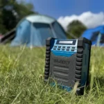 Majority Landbeach Review: High-Quality DAB+ Outdoor Sound a blue speaker in the grass. Majority Landbeach Speaker review. {Tech} for Travel. https://techfortravel.co.uk