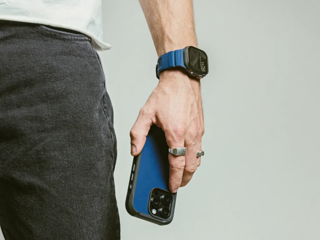 Nomad Goods iPhone Case – {Tech} for Travel a person holding a cell phone. Nomad Goods iPhone Case. {Tech} for Travel. https://techfortravel.co.uk