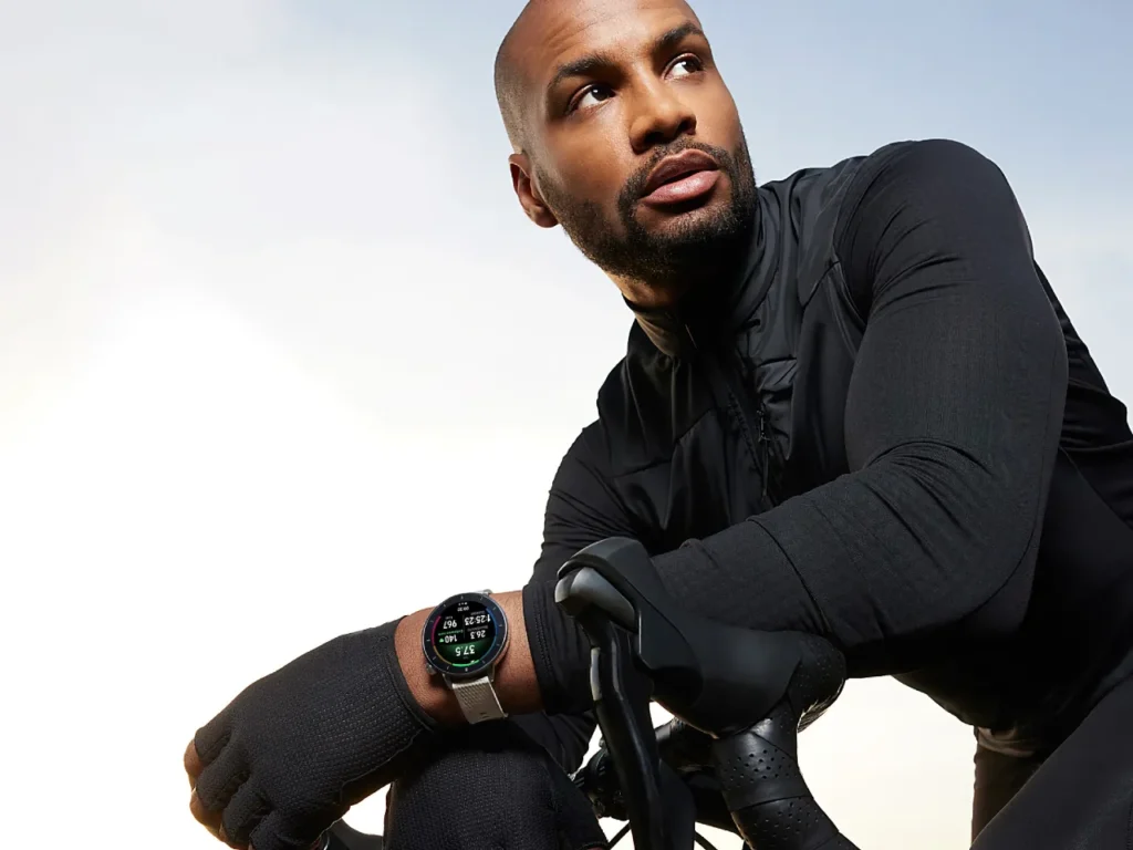 OnePlus Watch 3 43mm hero – {Tech} for Travel a man sitting on a bicycle. OnePlus Watch 3 43mm. {Tech} for Travel. https://techfortravel.co.uk