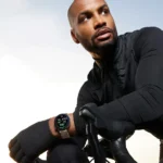a man sitting on a bicycle. OnePlus Watch 3 43mm. {Tech} for Travel. https://techfortravel.co.uk