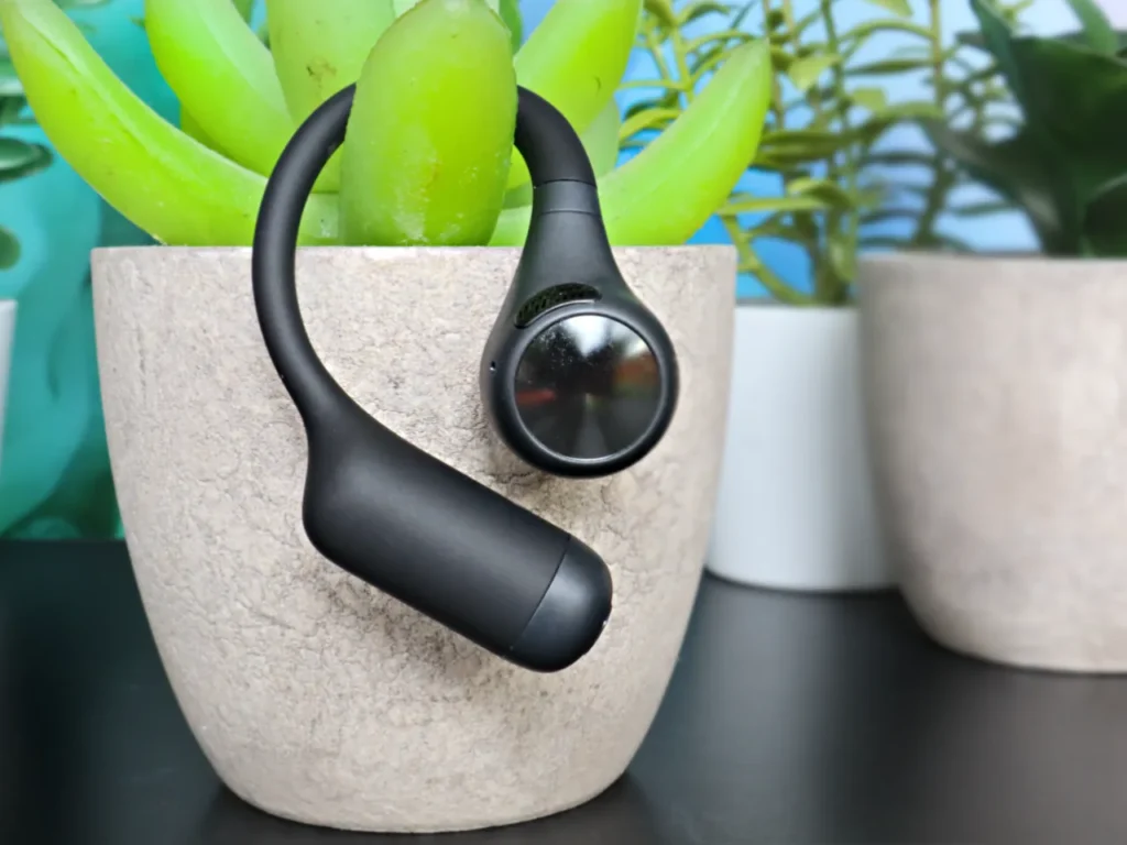 OpenRock S2 Earbuds Profile – {Tech} for Travel a black earphones in a potted plant. OpenRock S2 Earbuds review. {Tech} for Travel. https://techfortravel.co.uk