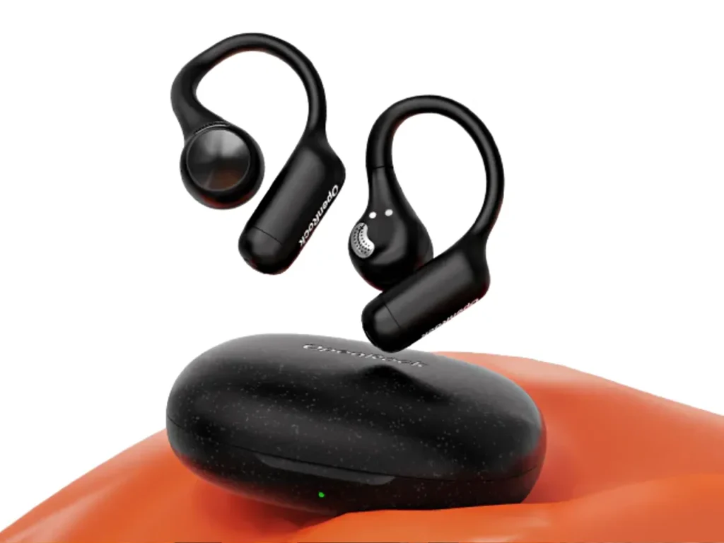 OpenRock S2 Earbuds Review Out of case – {Tech} for Travel a pair of black earphones flying over an orange object. OpenRock S2 Earbuds review. {Tech} for Travel. https://techfortravel.co.uk
