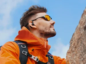 a man wearing sunglasses and a backpack. OpenRock S2 Earbuds review. {Tech} for Travel. https://techfortravel.co.uk