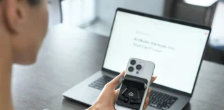 IFA 2025: Komutr MagSafe Earbuds Are Built for Commuters a person holding a phone and a laptop. Komutr MagSafe earbuds. IFA 2025 News. {Tech} for Travel. https://techfortravel.co.uk