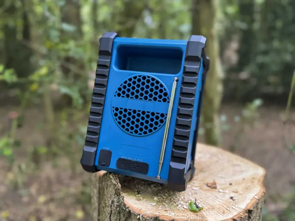Majority Landbeach ports – {Tech} for Travel a blue speaker on a tree stump. Majority Landbeach Speaker review. {Tech} for Travel. https://techfortravel.co.uk