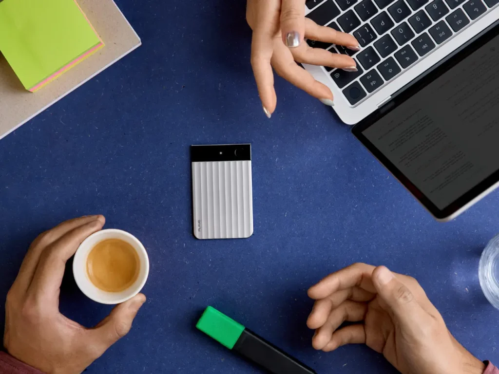 Plaud Note Pro In Use – {Tech} for Travel a person's hands holding a cup of coffee and a laptop. Plaud Note Pro. IFA 2025 news. {Tech} for Travel. https://techfortravel.co.uk